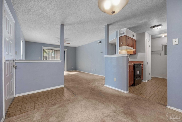 2201 Scenic Hwy Unit M1, Pensacola, FL 32503 - unfurnished living room with baseboards, ceiling fan, brick patterned floors, and light carpet