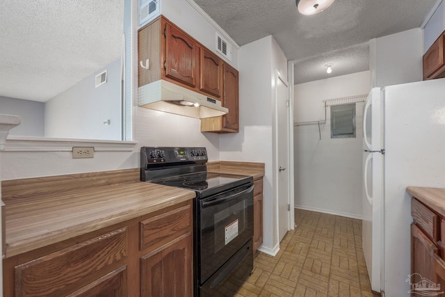 2201 Scenic Hwy Unit M1, Pensacola, FL 32503 - kitchen featuring black range with electric cooktop, freestanding refrigerator, under cabinet range hood, a textured ceiling, and brick patterned floors