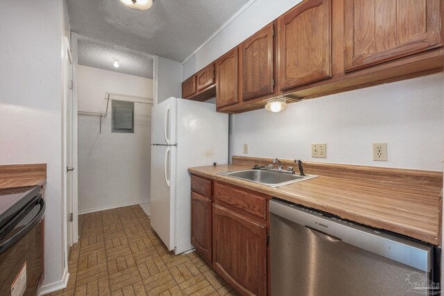 2201 Scenic Hwy Unit M1, Pensacola, FL 32503 - kitchen featuring stainless steel dishwasher, a sink, brick patterned floors, light countertops, and electric range