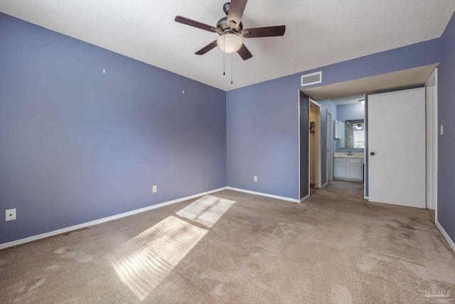 2201 Scenic Hwy Unit M1, Pensacola, FL 32503 - unfurnished room with ceiling fan, carpet flooring, a textured ceiling, and baseboards