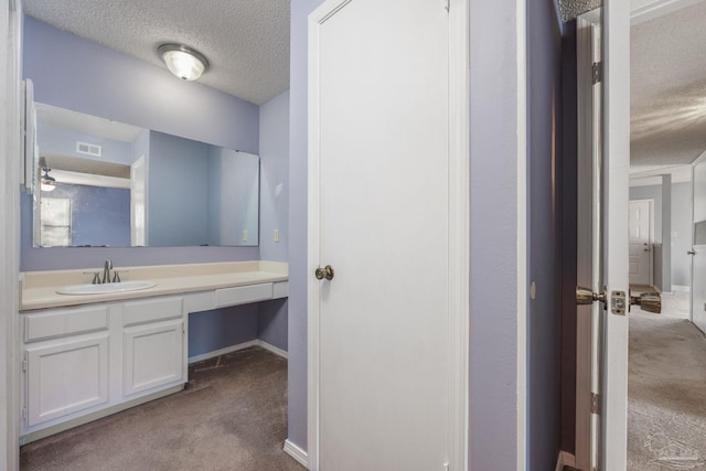 2201 Scenic Hwy Unit M1, Pensacola, FL 32503 - bathroom with a textured ceiling, baseboards, and vanity