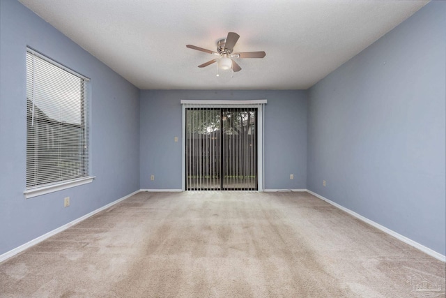 2201 Scenic Hwy Unit M1, Pensacola, FL 32503 - empty room with a ceiling fan, carpet flooring, and baseboards