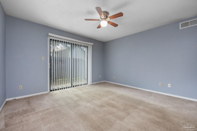 2201 Scenic Hwy Unit M1, Pensacola, FL 32503 - carpeted empty room featuring a ceiling fan, a textured ceiling, and baseboards
