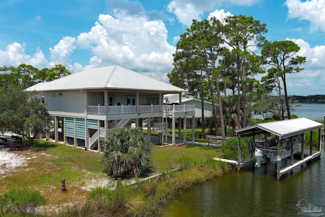 rear view of property featuring a water view