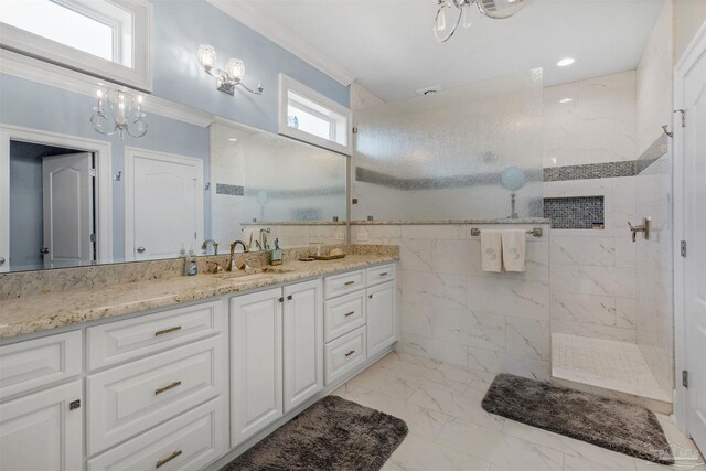 bathroom featuring tile patterned floors, vanity, a healthy amount of sunlight, and crown molding