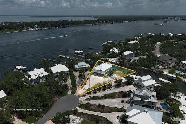 birds eye view of property featuring a water view