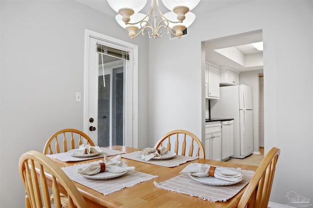 dining area with a chandelier