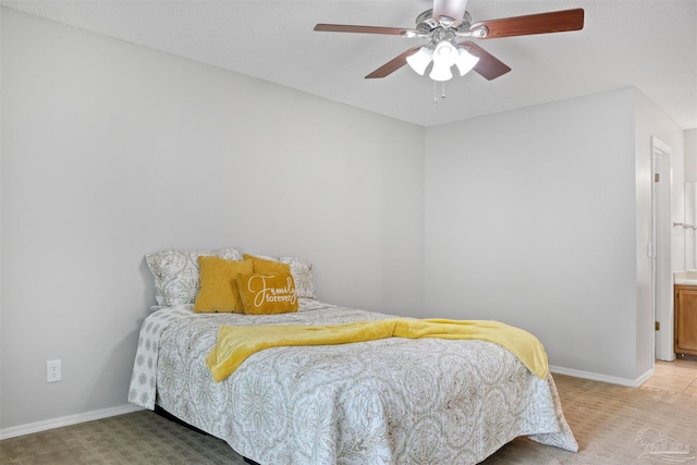 bedroom with baseboards, ceiling fan, and light colored carpet