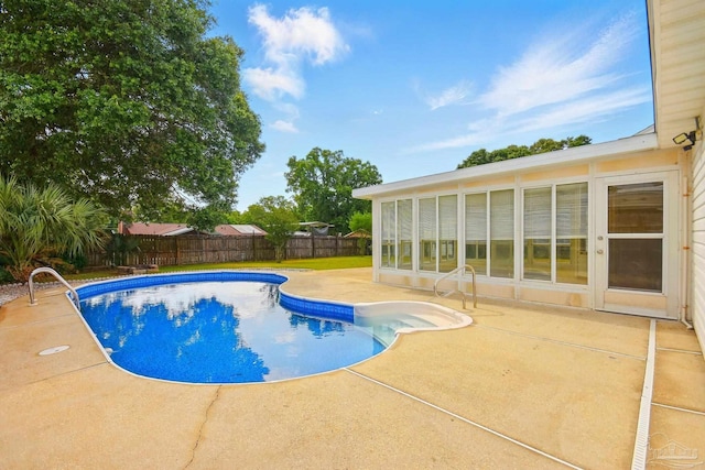 view of pool with a patio, a fenced in pool, and a fenced backyard