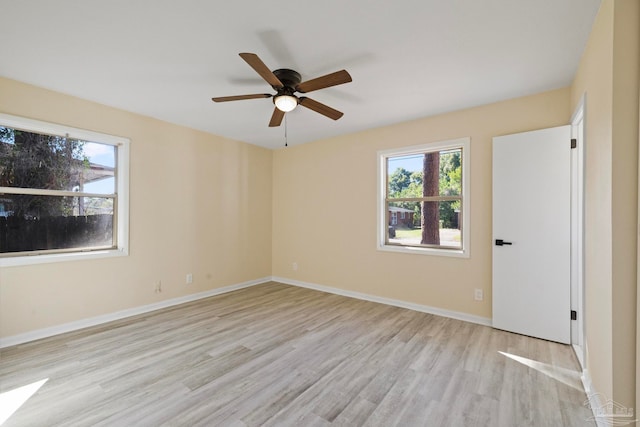 spare room with light hardwood / wood-style flooring and ceiling fan