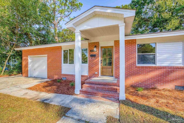 view of exterior entry featuring a garage