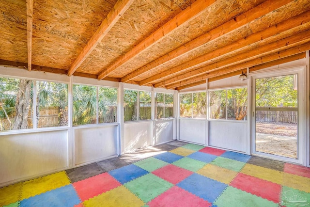 unfurnished sunroom with vaulted ceiling