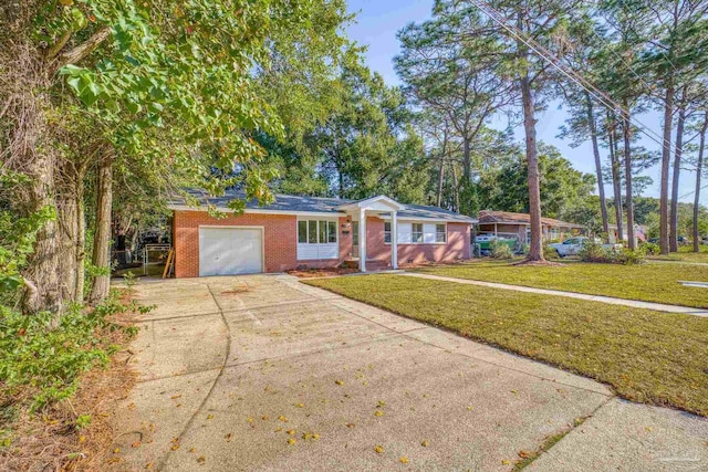 single story home with a garage and a front lawn