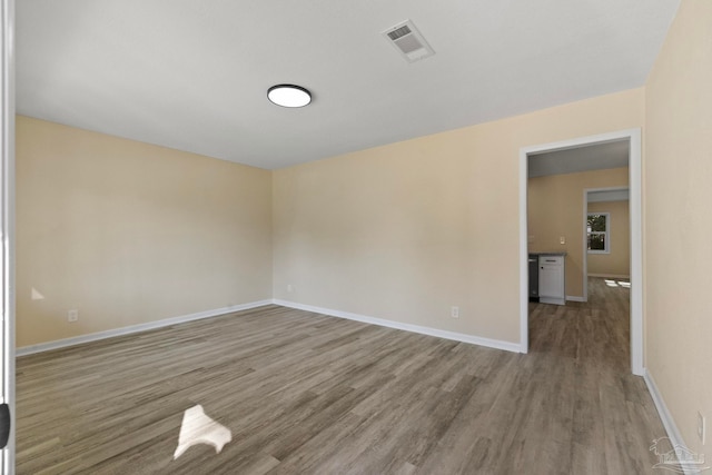 empty room featuring wood-type flooring