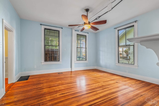 spare room with ceiling fan and light hardwood / wood-style flooring