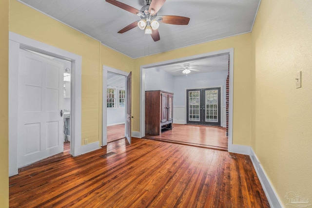 foyer entrance featuring dark hardwood / wood-style flooring, french doors, and ceiling fan