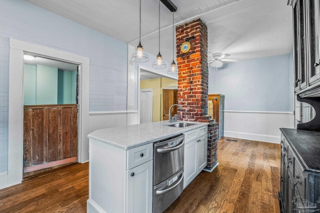 kitchen featuring white cabinetry, dark hardwood / wood-style floors, sink, and hanging light fixtures