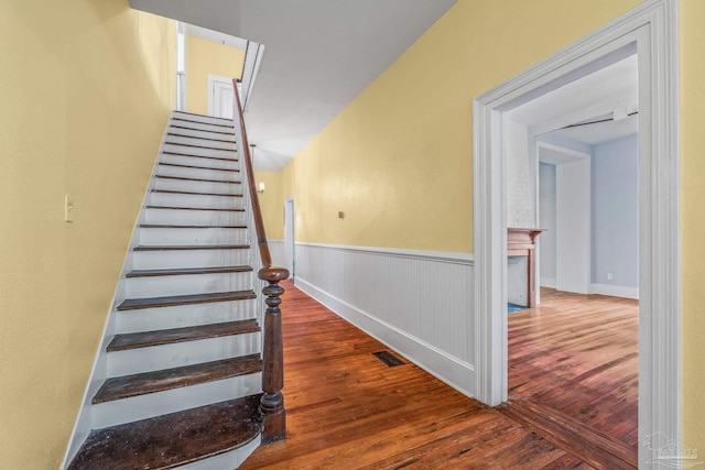 stairs featuring hardwood / wood-style flooring