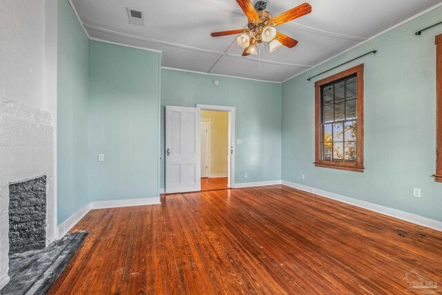 empty room with hardwood / wood-style floors and ceiling fan