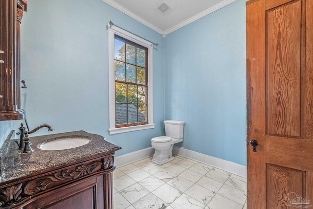 bathroom featuring ornamental molding, toilet, and vanity