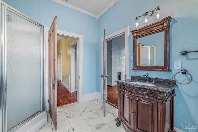 bathroom with a shower with door, ornamental molding, and vanity