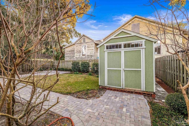 view of outbuilding featuring a lawn