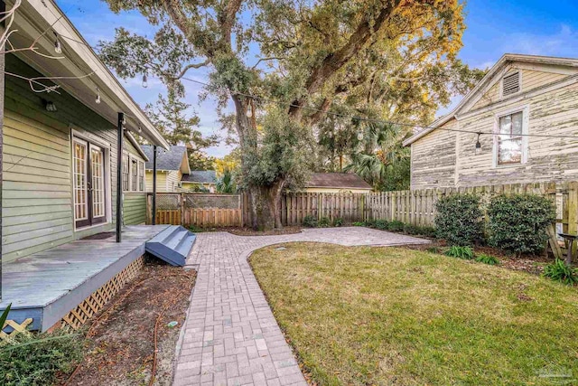 view of yard featuring a wooden deck