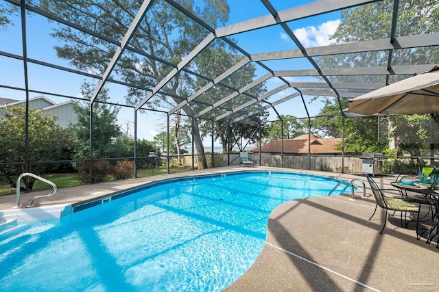 view of pool with a patio area, a lanai, and a fenced in pool