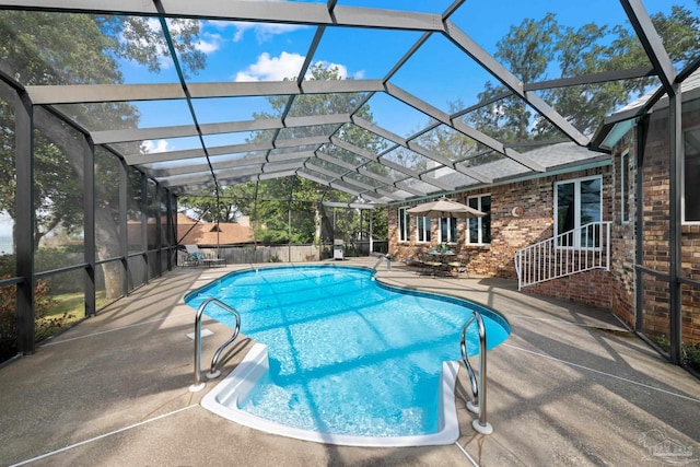 view of pool featuring a fenced in pool, a lanai, and a patio area