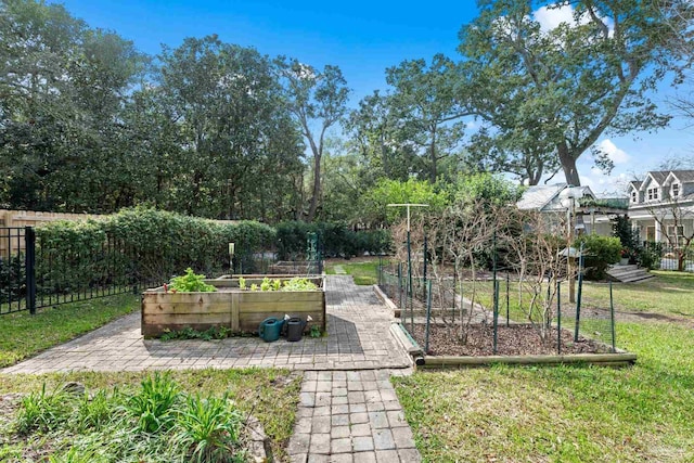 view of yard with a garden and fence