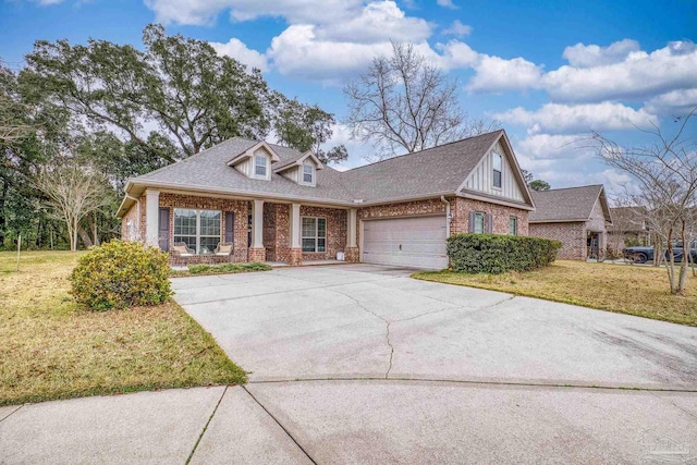 view of front of property with driveway, roof with shingles, an attached garage, a front lawn, and brick siding