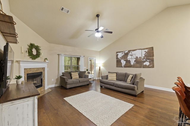 living room featuring ceiling fan, high vaulted ceiling, a fireplace, baseboards, and dark wood-style floors