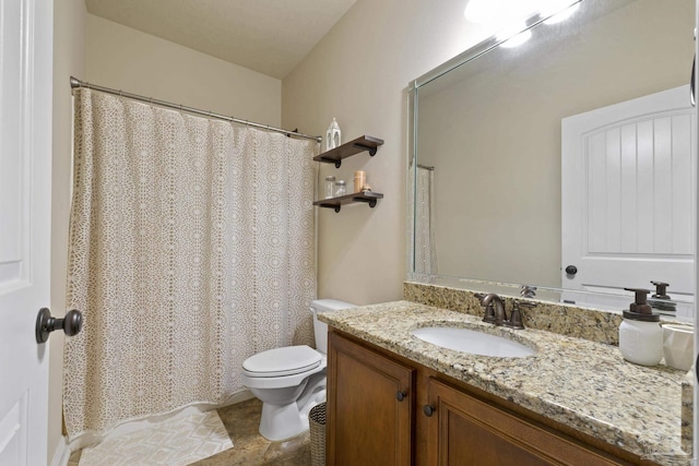 bathroom with toilet and vanity