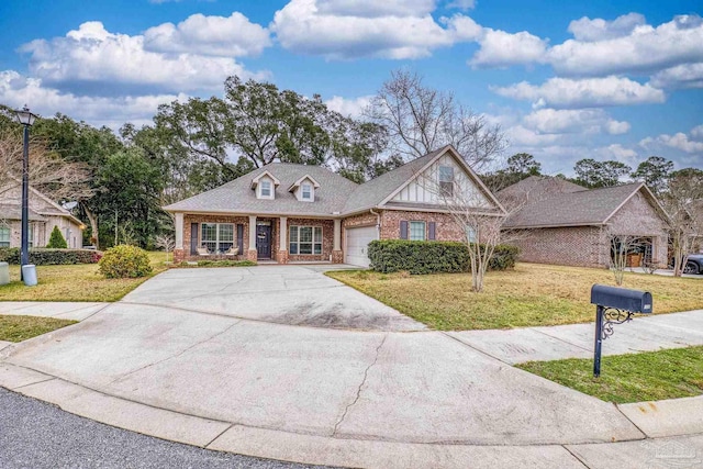 view of front of home featuring a garage, concrete driveway, roof with shingles, a front lawn, and brick siding