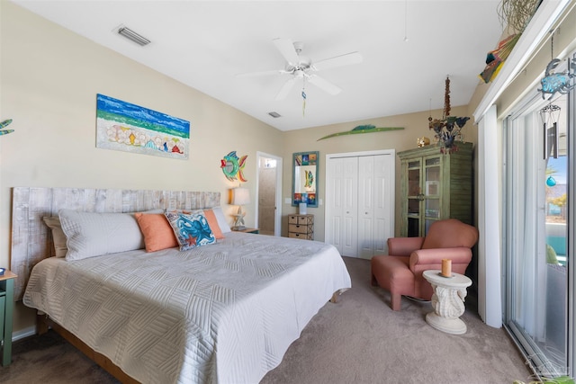 bedroom with a closet, visible vents, and carpet