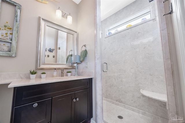 bathroom with vanity and a shower stall