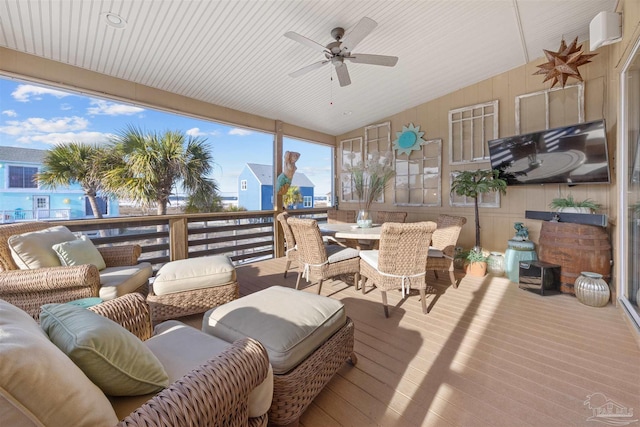 deck featuring a ceiling fan, outdoor dining area, and outdoor lounge area