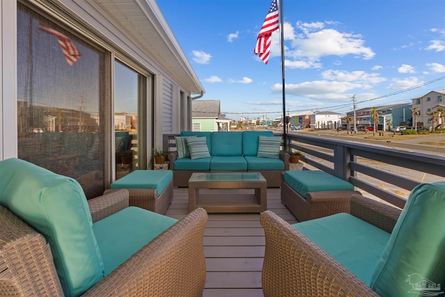 balcony featuring an outdoor living space and a residential view