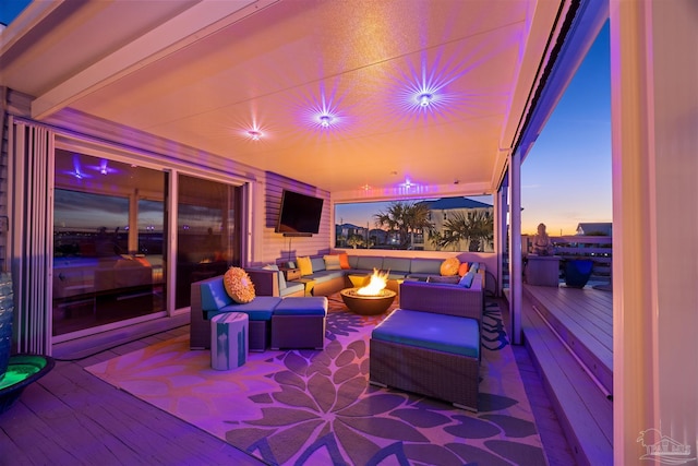 view of patio / terrace with an outdoor living space with a fire pit