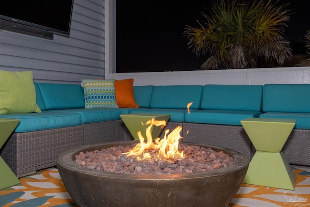 view of patio / terrace featuring an outdoor living space with a fire pit