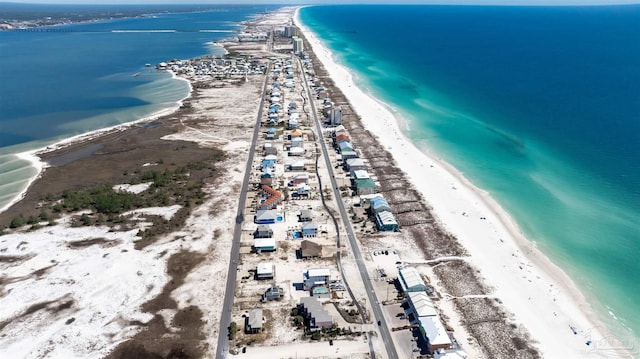 aerial view with a water view and a view of the beach