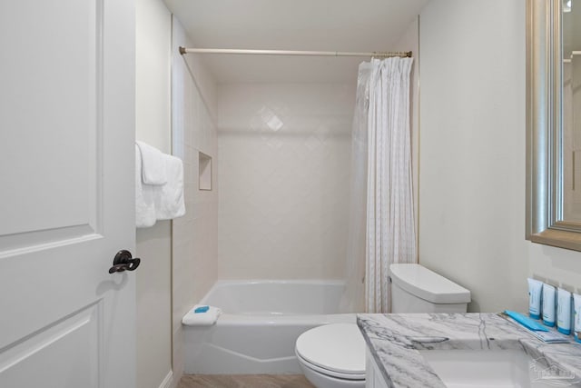 full bathroom with toilet, vanity, and shower / bath combination with curtain