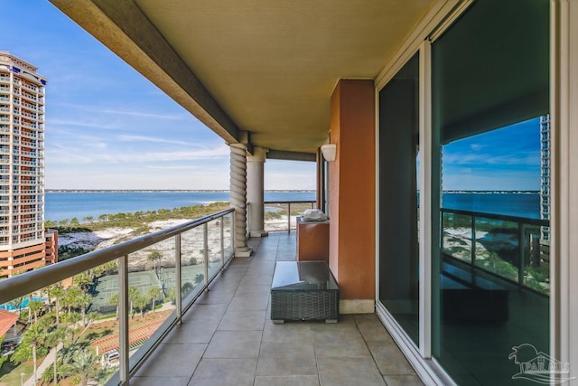 balcony featuring a water view