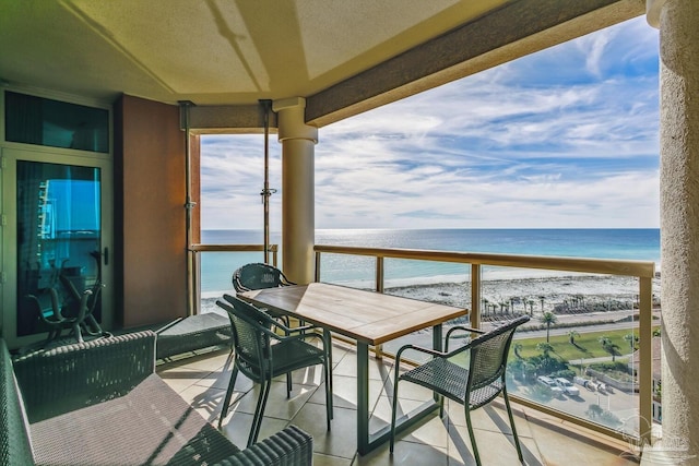 balcony with a view of the beach and a water view