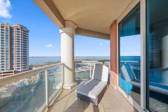 balcony featuring a water view