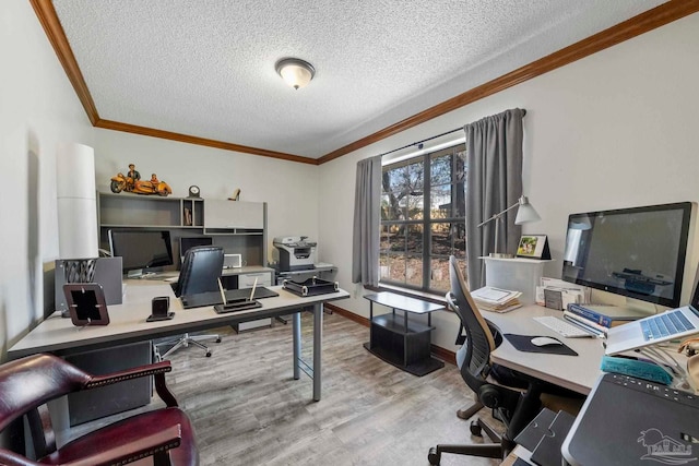 home office with baseboards, a textured ceiling, ornamental molding, and wood finished floors