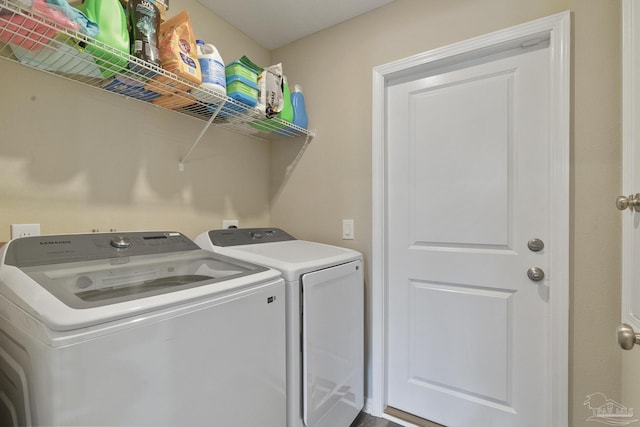 laundry area featuring laundry area and washer and clothes dryer