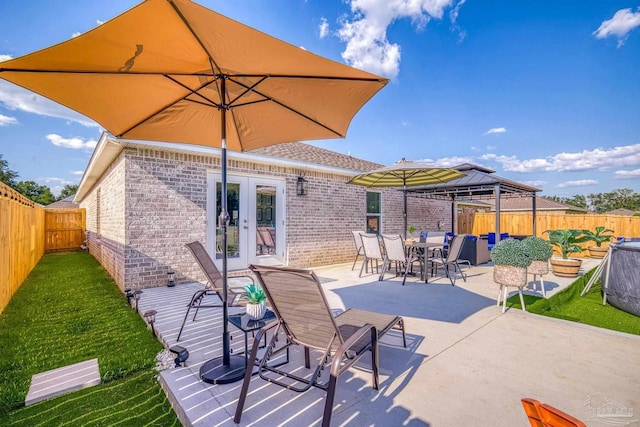 view of patio / terrace featuring french doors and a fenced backyard