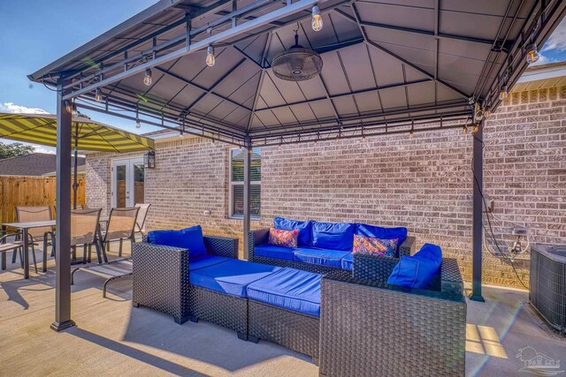 view of patio / terrace with an outdoor living space, a gazebo, and a fenced in pool