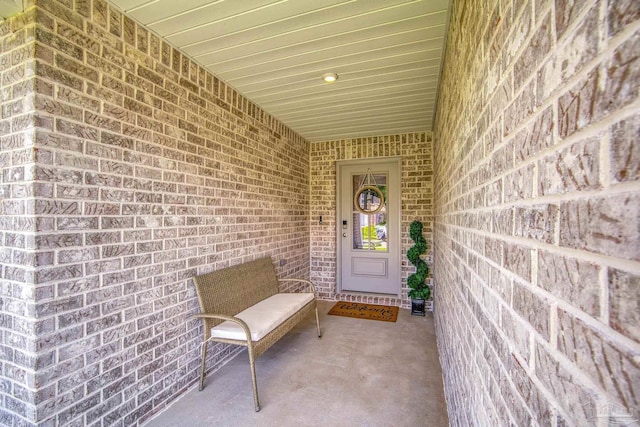 property entrance with brick siding